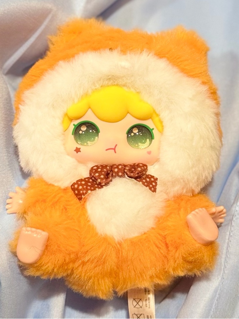 Plush Doll in Orange Fuzzy Hood
